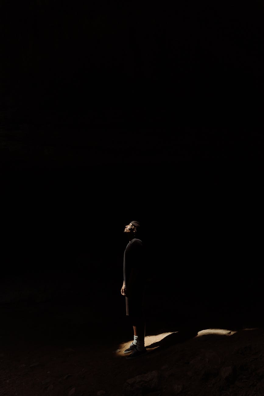 man standing inside the cave