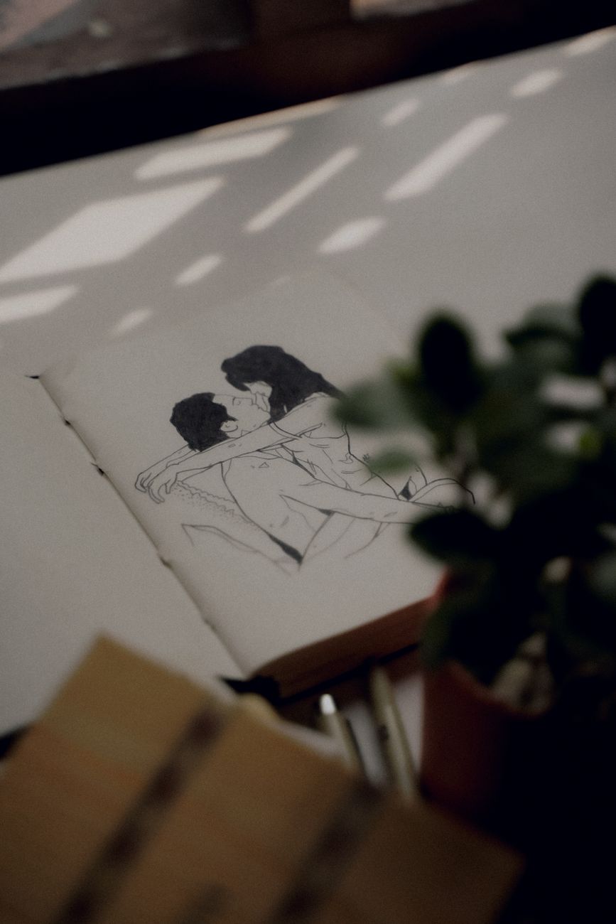 a drawing of a couple on a book