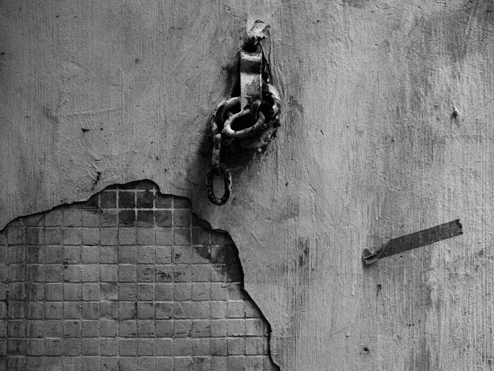 vintage chain on weathered wall in hong kong